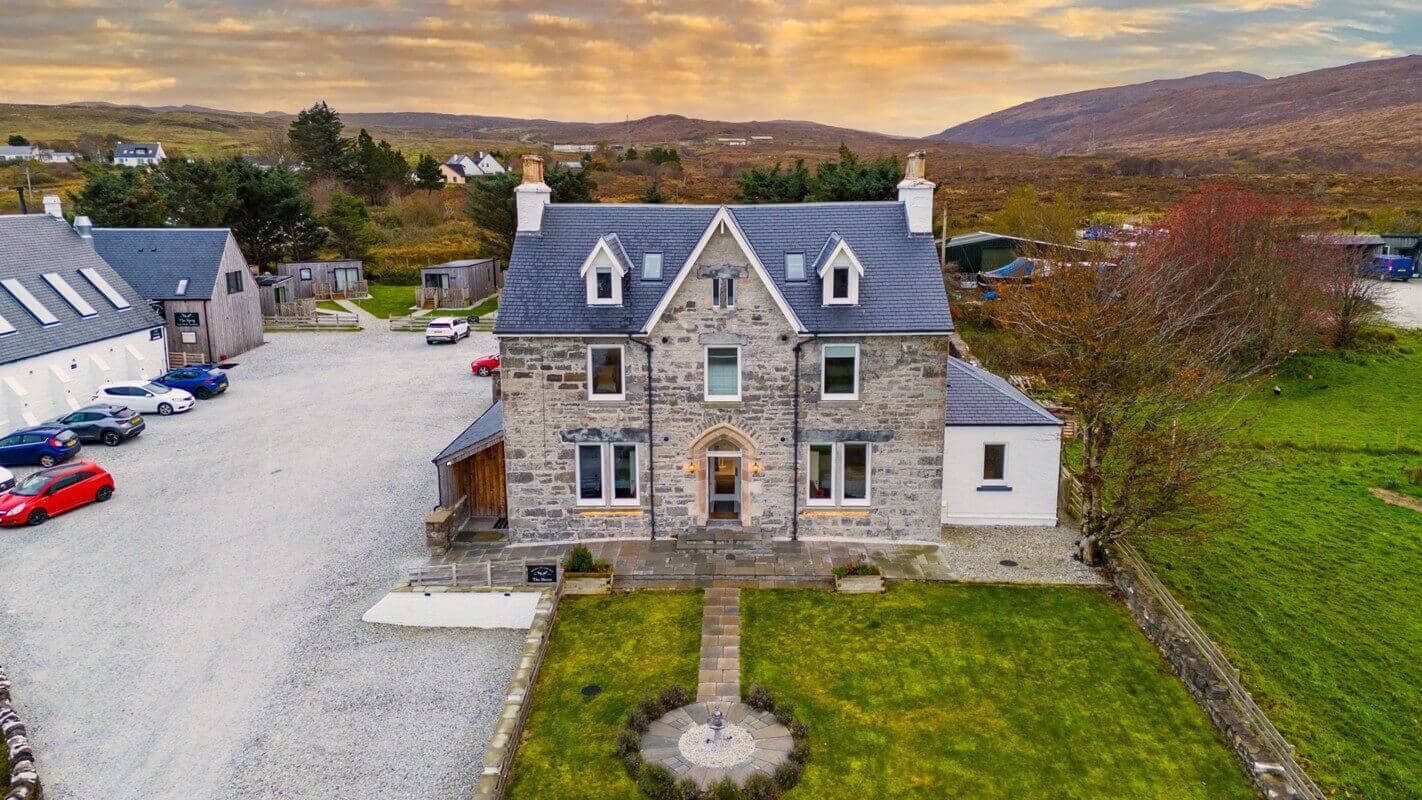 The Manse Hotel frontage with mountain backdrop in evening light